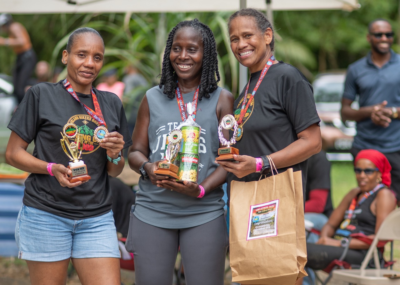 The top three women with their trophies and medals