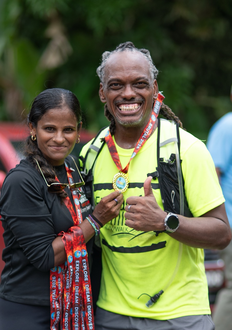Two smiling finishers with their medals
