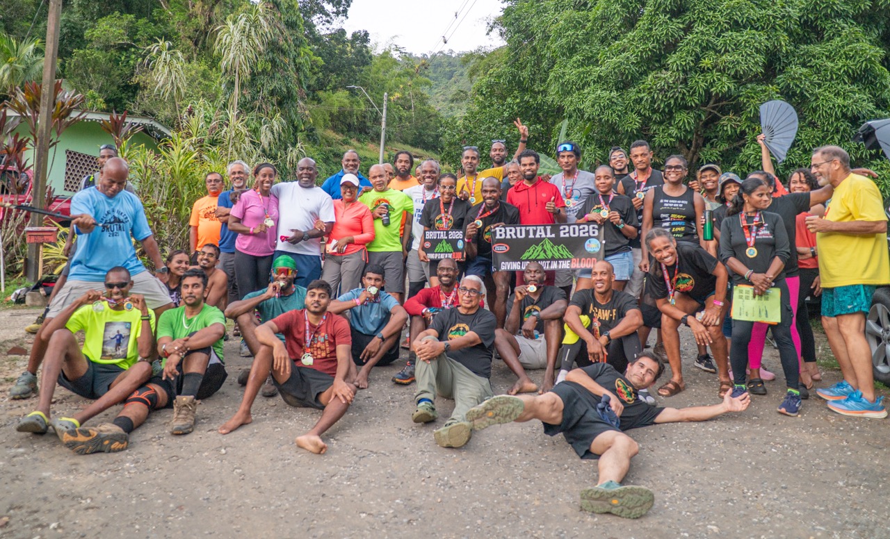 The Island Hikers group photo with the Brutal 2026 banner